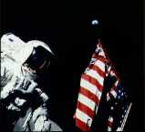 Astronaut on lunar surface, American
flag on the right